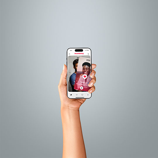 A hand holding a dating app mockup