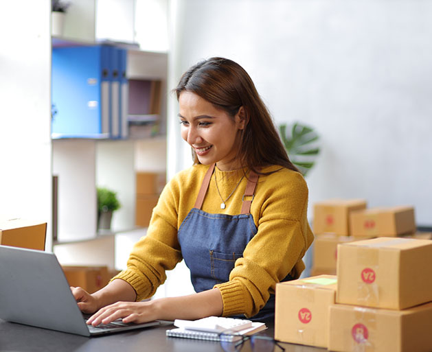 A shop owner utilizing back office tools from GeminiPay's POS systems