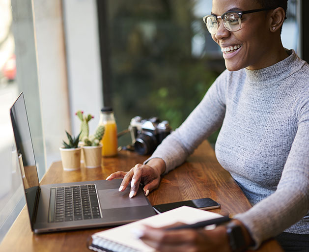 A woman enjoying fast funding services provided by GeminiPay's POS services